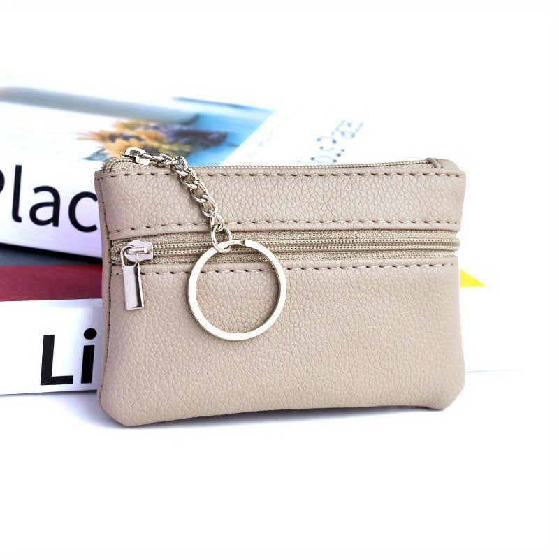 A Small Wallet with a Keychain That Holds Coins in a Mini Coin Purse.