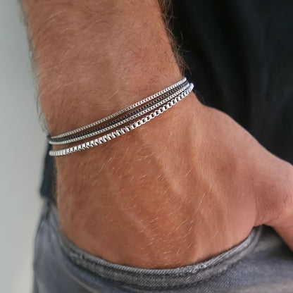 A Set of 4 Minimalist And Stylish Stainless Steel Bracelets for Men, Perfect for Gifting to a Boyfriend for Dates Or Everyday Wear.