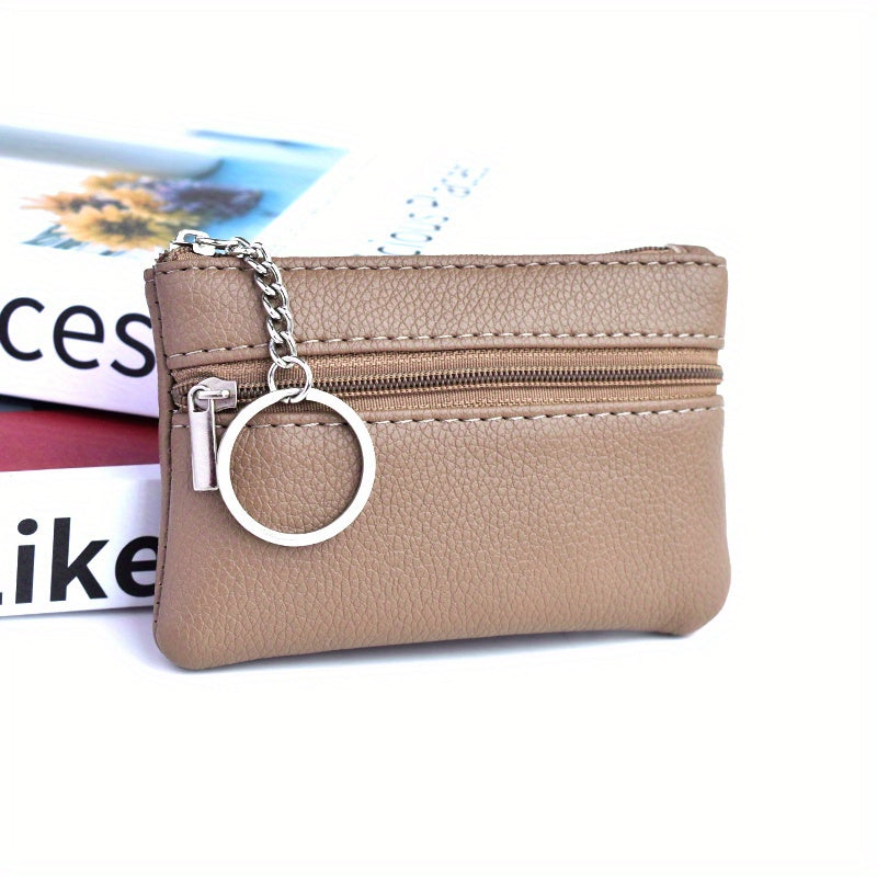 A Small Wallet with a Keychain That Holds Coins in a Mini Coin Purse.