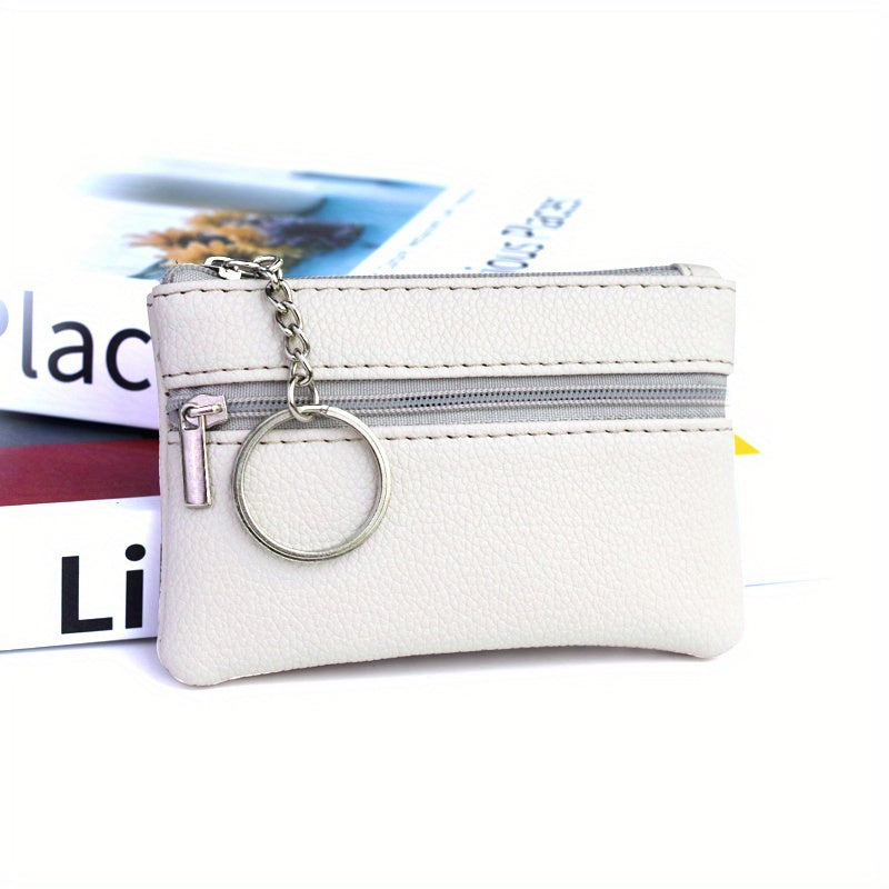 A Small Wallet with a Keychain That Holds Coins in a Mini Coin Purse.