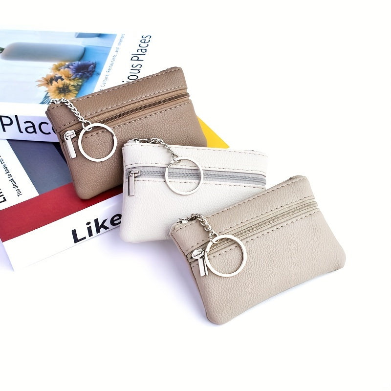 A Small Wallet with a Keychain That Holds Coins in a Mini Coin Purse.